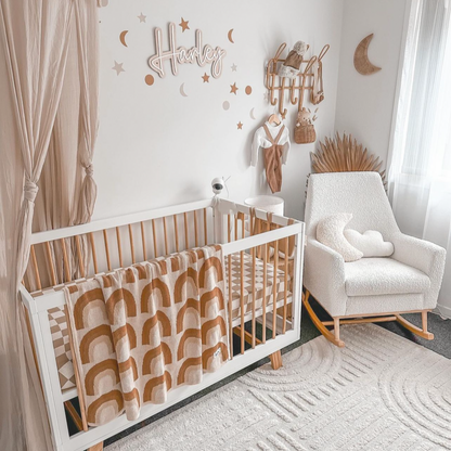 Soft minimal moon and cloud decor styled in aesthetic and cosy nursery.