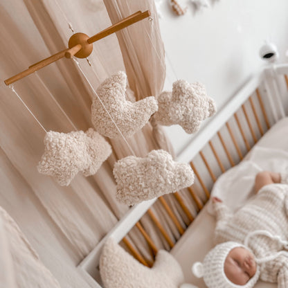 Baby mobile for cot or change table. Dreamer design with moons, stars and clouds. Styled in aesthetic minimal nursery.