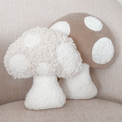 Small and mini mushroom cushions in neutral colour designs styled on chair. 