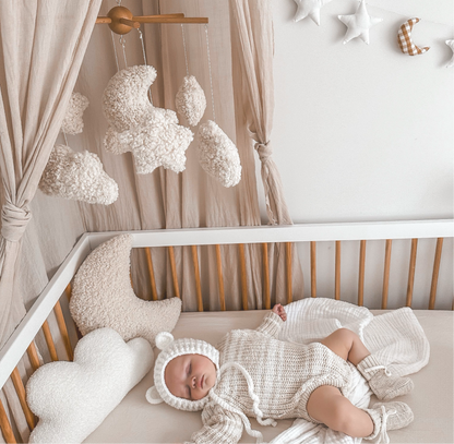Baby mobile for cot or change table. Dreamer design with moons, stars and clouds. Styled in aesthetic minimal nursery.