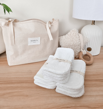 Handmade high quality burp cloths and face and body washers designed to be practical and aesthetic. White minimal design.