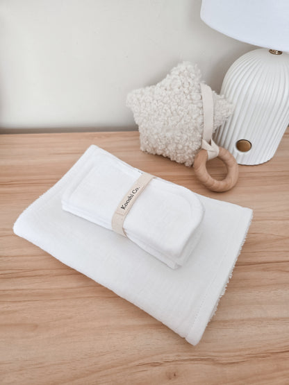 Handmade high quality burp cloths and face and body washers designed to be practical and aesthetic. White minimal design.