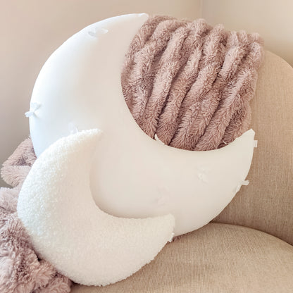 Custom moon with 3D butterfly applique over white cotton.  Styled on nursery chair in room with small white boucle moon